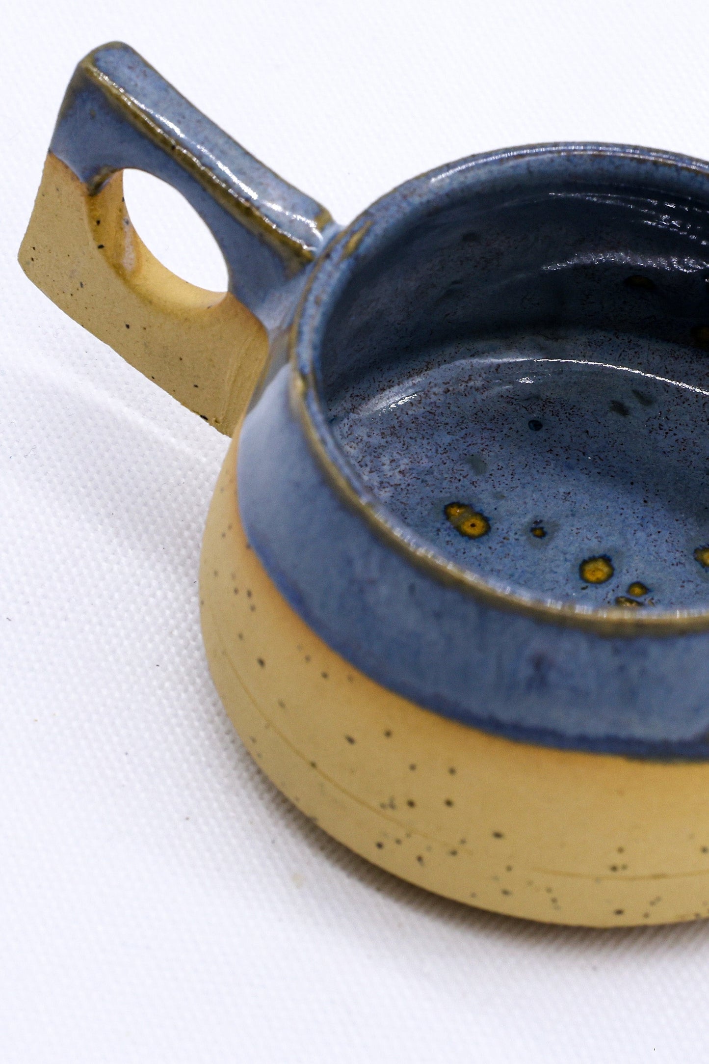 TerraBlu Formo Handmade Ceramic Stoneware Coffee Mug featuring a unique blue and yellow design.