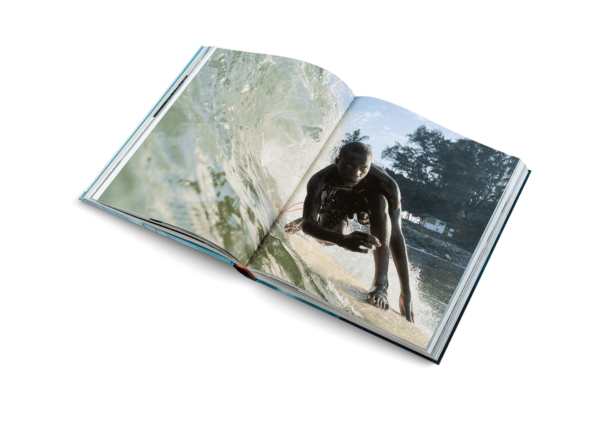Open book showing a person on a surfboard with a natural background