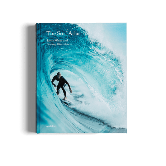 Book titled 'The Surf Atlas' with a surfer on a wave on the cover