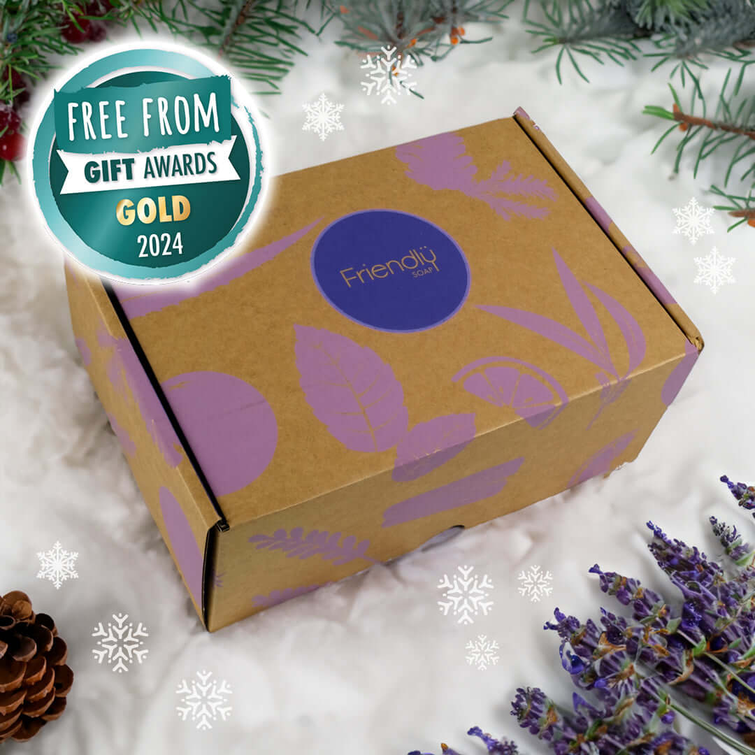 Tranquil Spa Hamper packaging with gold award badge on snowy background and lavender