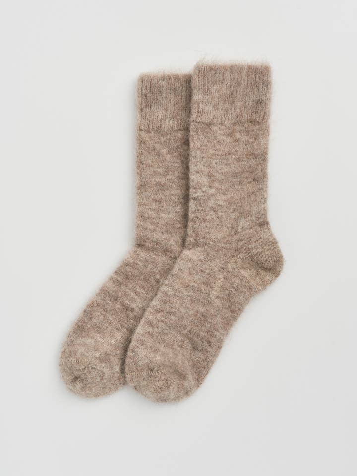 Alpaca Bed Socks in soft beige color, made from luxurious alpaca fabric for ultimate warmth and comfort.
