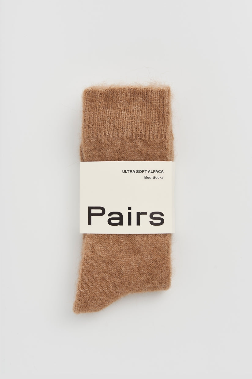 Alpaca Bed Socks in soft brown color, featuring a label that reads 'Ultra Soft Alpaca Bed Socks'.