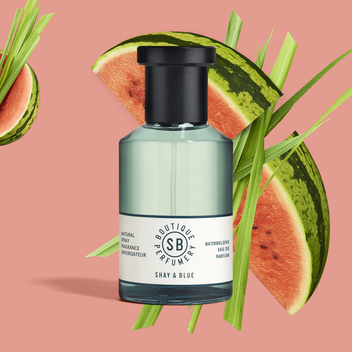 Watermelons Fragrance 100ml bottle with watermelon slices and green grass on a pink background.