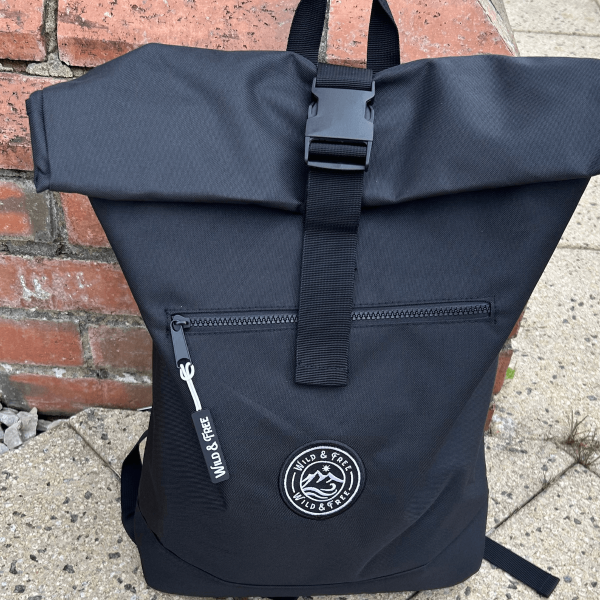 The Backpack by Wild & Free featuring a rolled top design and a zippered front for practicality, shop at Alewk.club.