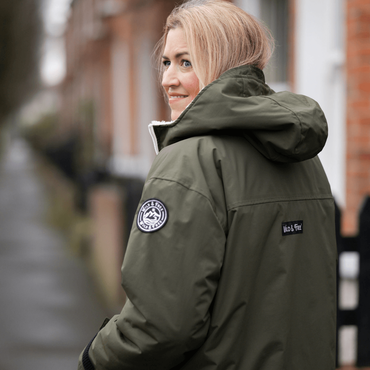 Raincoat & Changing Robe in One - The Classic Cobe Olive Green worn by a woman outdoors.