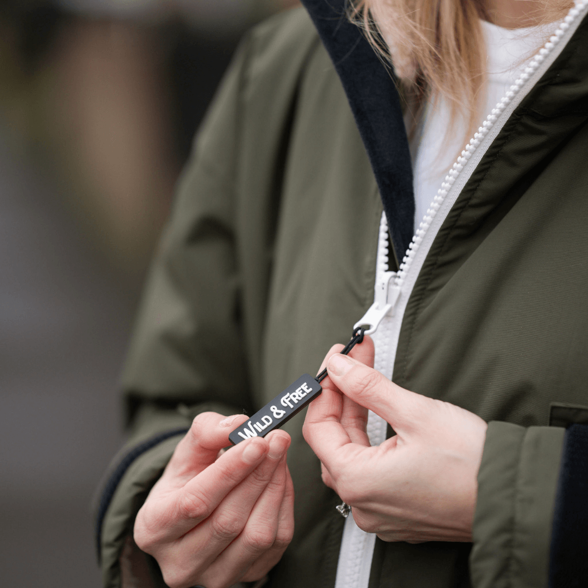 Raincoat & Changing Robe in One - The Classic Cobe Olive Green featuring a 'Wild & Free' tag.