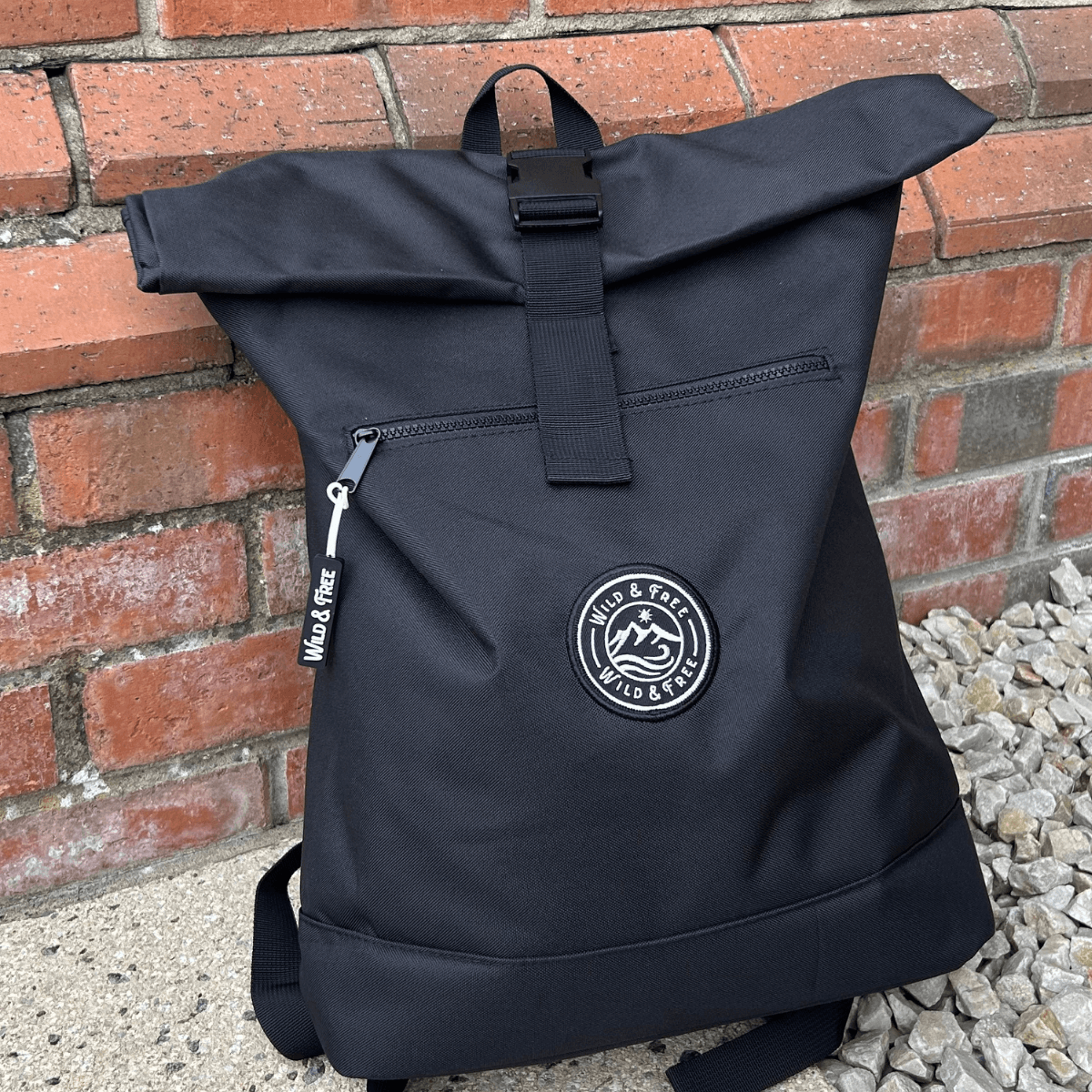 The Backpack by Wild & Free, a stylish roll-top design perfect for adventures, available at Alewk.club.