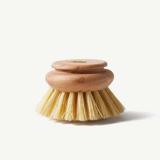 Wooden dish brush with bristle head on a white background